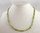 PERIDOT - collier formé de perles de péridot forme légèrement ovale
