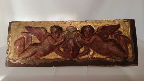 Gilt and red carved panel, Italy, first half of the 18th century
