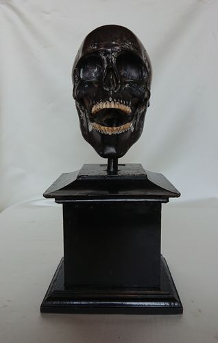 Wooden vanitas skull on pedestal, 18th century