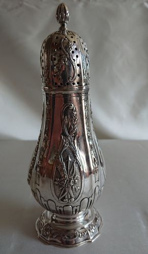 Silver caster, France, 18th century, with later repoussé decor