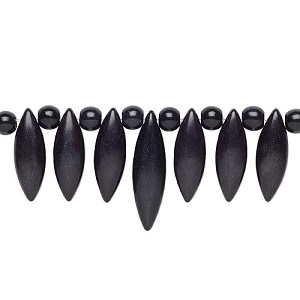 Magnesiet 15-delig center-piece in de kleur zwart, bestaande uit 7 marquise kralen en 8 ronde kralen